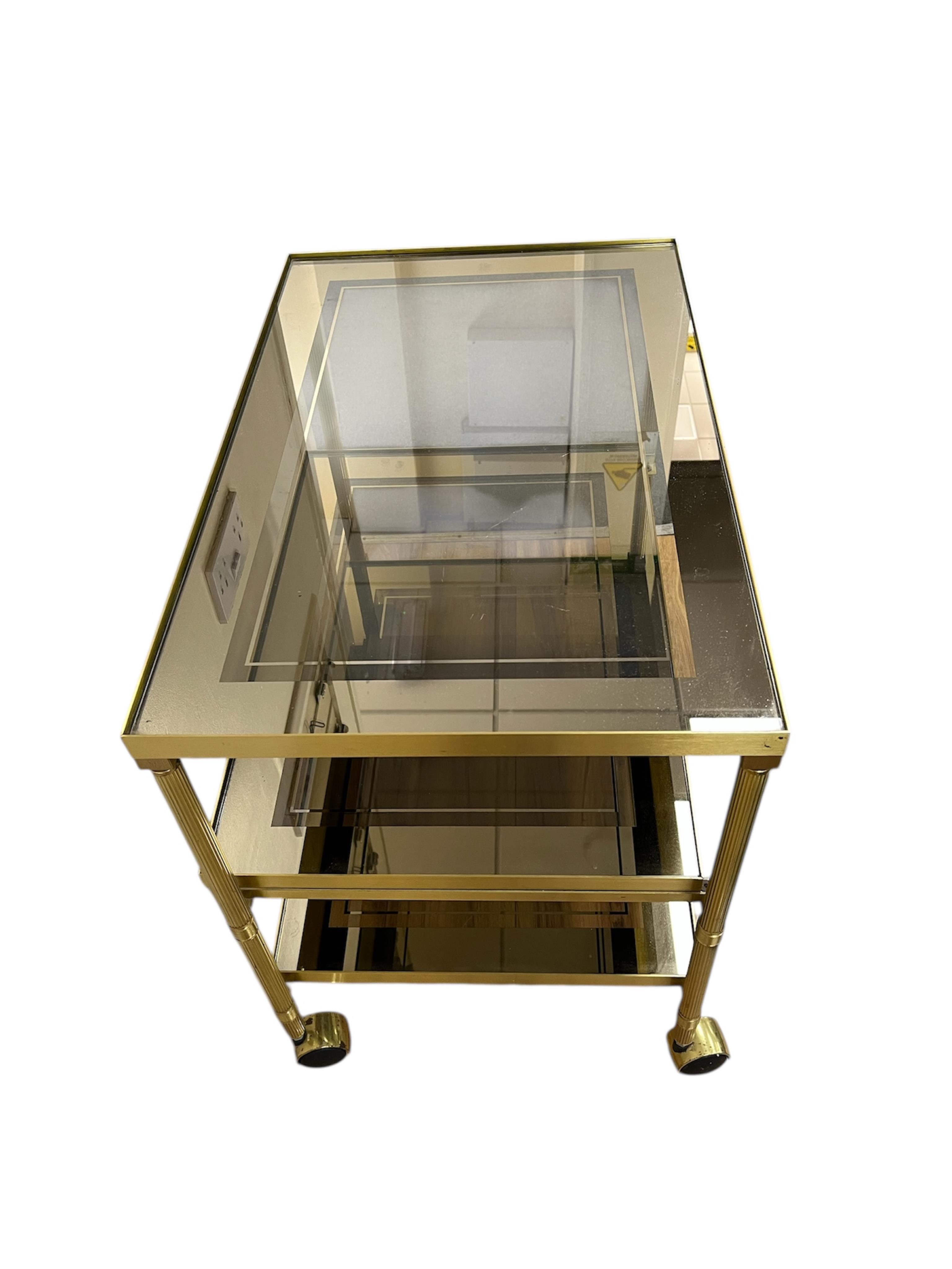A brass three tier tea trolley, width 67cm, depth 44cm, height 60cm